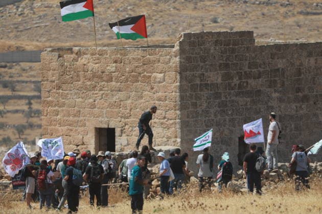 Israeli violations against Palestinians continue HEBRON, WEST BANK, PALESTINE - AUGUST 14: Palestinians and foreign activists gather to protest in support of their land, which they say is under threat of being seized by Israelis, and to express their determination not to leave their properties in Beit Sahour, Hebron Governorate, West Bank, on August 14, 2026. Armed Israelis who came to the area intervened and attempted to disperse the group. Mamoun Wazwaz Anadolu Hebron West Bank. Editorial use only. Please get in touch for any other usage.  Copyright: x2026xAnadoluxMamounxWazwazx