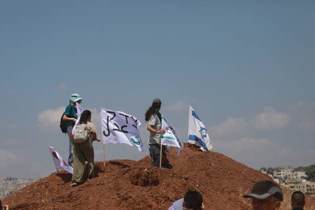 Israeli violations against Palestinians continue HEBRON, WEST BANK, PALESTINE - AUGUST 14: Palestinians and foreign activists gather to protest in support of their land, which they say is under threat of being seized by Israelis, and to express their determination not to leave their properties in Beit Sahour, Hebron Governorate, West Bank, on August 14, 2026. Armed Israelis who came to the area intervened and attempted to disperse the group. Mamoun Wazwaz Anadolu Hebron West Bank. Editorial use only. Please get in touch for any other usage.  Copyright: x2026xAnadoluxMamounxWazwazx