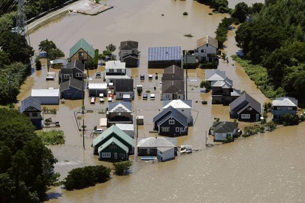 Aftermath of torrential rain in eastern Japan Photo taken from a Kyodo News helicopter shows a residential area submerged in floodwater in Oamishirasato in Chiba Prefecture, east of Tokyo, on Aug. 14, 2026, after torrential rain overnight.  A14AA0005625810P