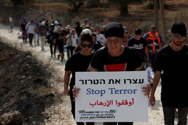 Activists attempt to deliver supplies to Palestinian families near Nablus NABLUS, WEST BANK, PALESTINE - AUGUST 14: Palestinian, Israeli and foreign activists attempt to deliver basic supplies to three Palestinian families living in the Ras al-Ayn area of Qusra, south of Nablus in the West Bank, Palestine, on August 14, 2026, as Israelis have blocked roads leading to the families’ homes since August 9, restricting access to and from the area in the presence of Israeli soldiers, with the restrictions remaining in place. Issam Rimawi Anadolu Nablus West Bank. Editorial use only. Please get in touch for any other usage.  Copyright: x2026xAnadoluxIssamxRimawix