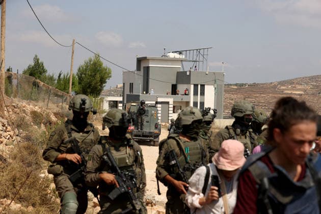 Activists attempt to deliver supplies to Palestinian families near Nablus NABLUS, WEST BANK, PALESTINE - AUGUST 14: Palestinian, Israeli and foreign activists attempt to deliver basic supplies to three Palestinian families living in the Ras al-Ayn area of Qusra, south of Nablus in the West Bank, Palestine, on August 14, 2026, as Israelis have blocked roads leading to the families’ homes since August 9, restricting access to and from the area in the presence of Israeli soldiers, with the restrictions remaining in place. Issam Rimawi Anadolu Nablus West Bank. Editorial use only. Please get in touch for any other usage.  Copyright: x2026xAnadoluxIssamxRimawix