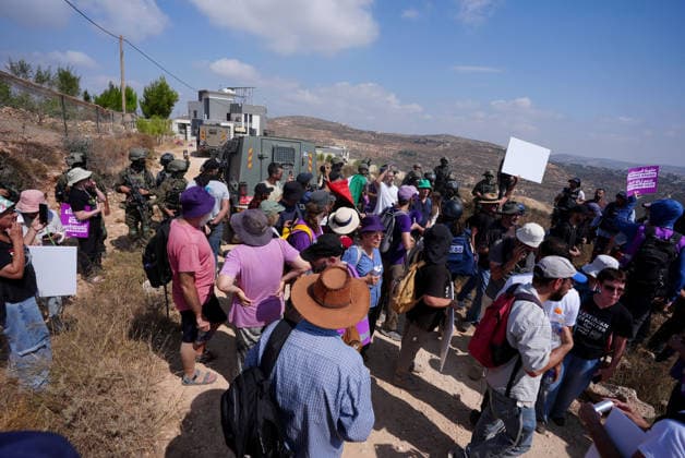 Activists attempt to deliver supplies to Palestinian families near Nablus NABLUS, WEST BANK, PALESTINE - AUGUST 14: Palestinian, Israeli and foreign activists attempt to deliver basic supplies to three Palestinian families living in the Ras al-Ayn area of Qusra, south of Nablus in the West Bank, Palestine, on August 14, 2026, as Israelis have blocked roads leading to the families’ homes since August 9, restricting access to and from the area in the presence of Israeli soldiers, with the restrictions remaining in place. Issam Rimawi Anadolu Nablus West Bank. Editorial use only. Please get in touch for any other usage.  Copyright: x2026xAnadoluxIssamxRimawix