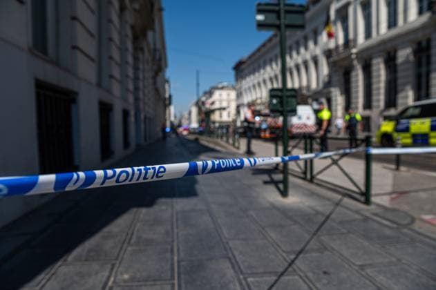 Emergency services pictured on the site of an explosion at the Treurenberg in the city center of Brussels, Friday 14 August 2026. According to the first information, two explosion happened in a building which was evacuated earlier in the day after a gas leak was detected, injuring two people.  EMILExWINDAL 1081058063st