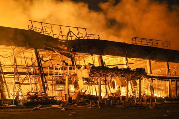 RUSSIA, DONETSK PEOPLE S REPUBLIC - AUGUST 14, 2026: A fire breaks out after a Ukrainian drone strike on the Galaktika Galaxy shopping centre in Yenakiyevo, northeast of Donetsk. Dmitry Yagodkin TASS  96146249
