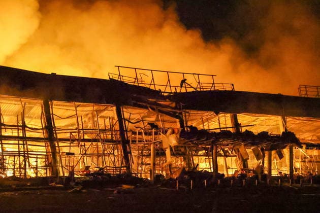RUSSIA, DONETSK PEOPLE S REPUBLIC - AUGUST 14, 2026: A fire breaks out after a Ukrainian drone strike on the Galaktika Galaxy shopping centre in Yenakiyevo, northeast of Donetsk. Dmitry Yagodkin TASS  96146261