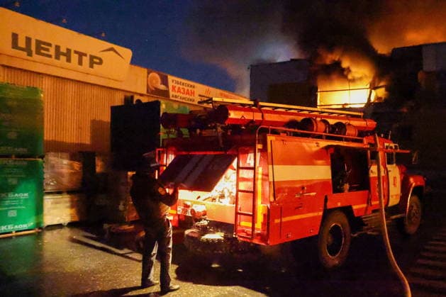 RUSSIA, DONETSK PEOPLE S REPUBLIC - AUGUST 14, 2026: An emergency unit responds to a fire caused by a Ukrainian drone strike on the Galaktika Galaxy shopping centre in Yenakiyevo, northeast of Donetsk. Dmitry Yagodkin TASS  96146264