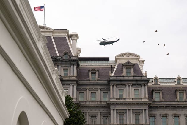A flock of birds seems to be following Marine One as it flies over the Eisenhower Executive Office Building and the White House in Washington, DC on Friday, August 14, 2026. Copyright: xAnnabellexGordonx xPoolxviaxCNPx MediaPunchx
