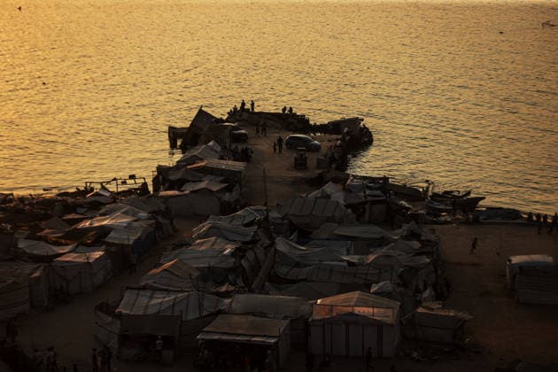 Daily life in Gaza amid the ongoing Israeli attacks despite ceasefire GAZA CITY, GAZA, PALESTINE - AUGUST 14: Displaced Palestinians living along the coastal strip of blockaded Gaza City carry out daily activities among the ruins of destroyed buildings during sunset in Gaza, Palestine on August 14, 2026. Deprived of basic necessities following Israeli attacks, families struggle to survive in makeshift tents pitched near the rubble of their homes and inside heavily damaged structures under severe conditions. Ali Jadallah Anadolu Gaza City Gaza. Editorial use only. Please get in touch for any other usage.  Copyright: x2026xAnadoluxAlixJadallahx