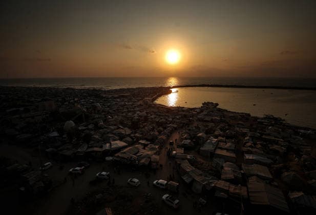 Daily life in Gaza amid the ongoing Israeli attacks despite ceasefire GAZA CITY, GAZA, PALESTINE - AUGUST 14: Displaced Palestinians living along the coastal strip of blockaded Gaza City carry out daily activities among the ruins of destroyed buildings during sunset in Gaza, Palestine on August 14, 2026. Deprived of basic necessities following Israeli attacks, families struggle to survive in makeshift tents pitched near the rubble of their homes and inside heavily damaged structures under severe conditions. Ali Jadallah Anadolu Gaza City Gaza. Editorial use only. Please get in touch for any other usage.  Copyright: x2026xAnadoluxAlixJadallahx