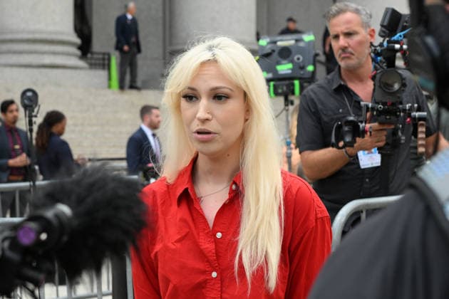 August 14, 2026, New York, New York, USA: August 14, 2026 - New York, NY, USA - Mangione supporter seen after Luigi Mangione enters an open guilty plea in federal court, admitting to all charges without any accommodations. He faces a maximum penalty of life in prison for the assassination of United Healthcare CEO, Brian Thompson on a Manhattan street. (Andrea RENAULT Zuma Press) New York USA - ZUMAg115 20260814_faf_g115_002 Copyright: xAndreaxRenaultx
