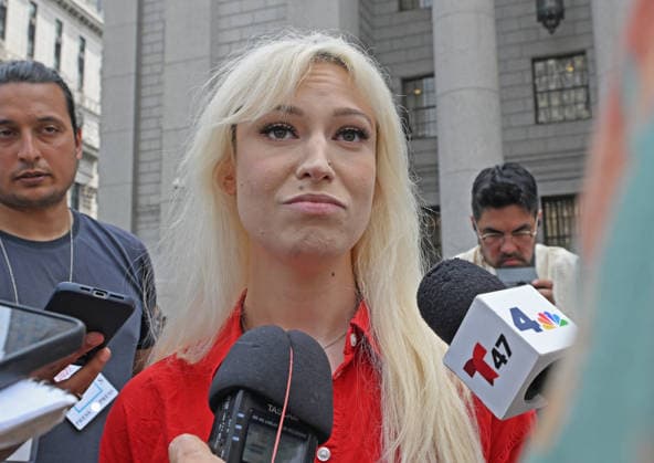 August 14, 2026, New York, New York, USA: August 14, 2026 - New York, NY, USA - Mangione supporter seen after Luigi Mangione enters an open guilty plea in federal court, admitting to all charges without any accommodations. He faces a maximum penalty of life in prison for the assassination of United Healthcare CEO, Brian Thompson on a Manhattan street. (Andrea RENAULT Zuma Press) New York USA  - ZUMAg115 20260814_faf_g115_001 Copyright: xAndreaxRenaultx