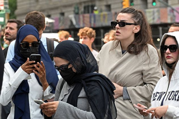 August 14, 2026, New York, New York, USA: August 14, 2026 - New York, NY, USA - Mangione supporters seen after Luigi Mangione enters an open guilty plea in federal court, admitting to all charges without any accommodations. He faces a maximum penalty of life in prison for the assassination of United Healthcare CEO, Brian Thompson on a Manhattan street. (Andrea RENAULT Zuma Press) New York USA - ZUMAg115 20260814_faf_g115_009 Copyright: xAndreaxRenaultx