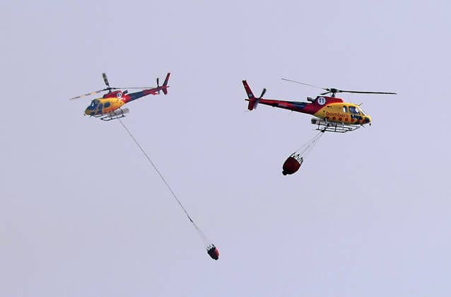Forest Fire In The Upper Part Of Barcelona Firefighters deployed 10 fire engines and four helicopters and brought the fire under control after four hours of work in Barcelona, Spain, on August 14, 2026. More than 500 wildfires have been recorded in Catalonia this summer. One of the latest broke out in the Collserola mountain range, near a telecommunications tower overlooking Barcelona. The blaze burned 10 hectares and threatened populated areas, prompting authorities to order residents in Barcelona s upper neighborhoods to remain indoors Barcelona Barcelona Spain  Copyright: xUrbanandsportx originalFilename: urbanandsport-forestfi260814_npsO8.jpg
