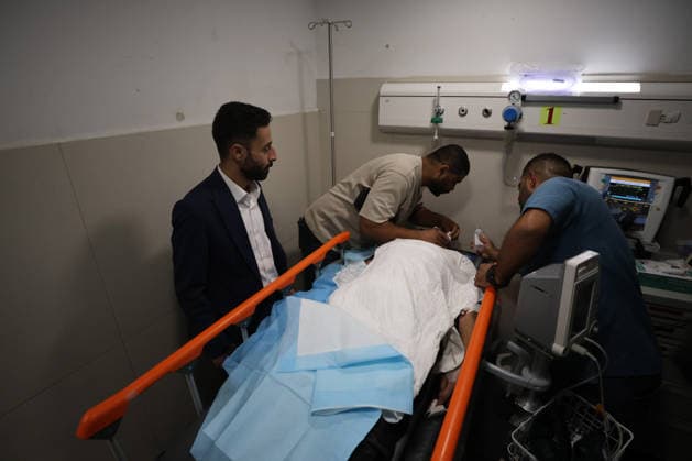 Sair Settler Attack Injures Palestinians Medical workers treat an injured Palestinian on a stretcher at a hospital after an attack in Sa™ir, east of Hebron in the occupied West Bank, on August 14, 2026. The three Palestinians were wounded when settlers opened fire during the attack on the town, according to information provided by the photographer. Hebron West Bank Palestinian Territories Copyright: xMosabxShawerx