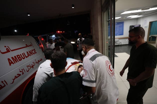 Sair Settler Attack Injures Palestinians Palestinian Red Crescent medics load an injured Palestinian into an ambulance after an attack in Sa™ir, east of Hebron in the occupied West Bank, on August 14, 2026. The three Palestinians were wounded when settlers opened fire during the attack on the town, according to information provided by the photographer. Hebron West Bank Palestinian Territories Copyright: xMosabxShawerx