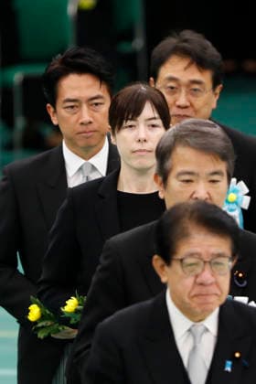 August 15, 2026, Tokyo, Japan: Japanese political figures and cabinet members line up to lay flowers during a memorial ceremony marking the 81st anniversary of Japan s surrender in World War II at Nippon Budokan in Tokyo. Among those present in the procession are Shinjiro Koizumi Minister of Defense of Japan and Kimi Onoda Minister in Charge of Economic Security of Japan Tokyo Japan - ZUMAm191 20260815_aap_m191_026 Copyright: xRodrigoxReyesxMarinx