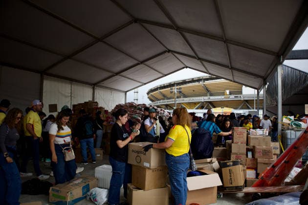 August 14, 2026, Bogota, Bogota D.C, Colombia: People in Bogota, Colombia gather to collect and categorize donations for the victims of the 7,4 earthquake that struck Colombia on August 10 outside El Campin Stadium on August 14, 2026. Bogota Colombia - ZUMAvp1_ 20260814_zia_vp1_034 Copyright: xIsabellaxBobadillax