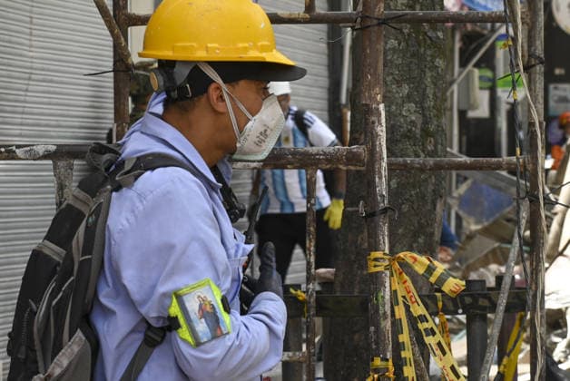 Search and rescue operations continue in quake-hit Pereira PEREIRA, COLOMBIA - AUGUST 14: A man wears a religious symbol on his arm as search and rescue operations continue at various locations across Pereira, in Colombia, on August 14, 2026. The death toll has reached 94, and 41,600 families have been affected, according to a report by Colombian President Abelardo de la Espriella, who visited Pereira and pledged to support the city and its reconstruction. Alexis Munera Anadolu Pereira Colombia. Editorial use only. Please get in touch for any other usage.  Copyright: x2026xAnadoluxAlexisxMunerax
