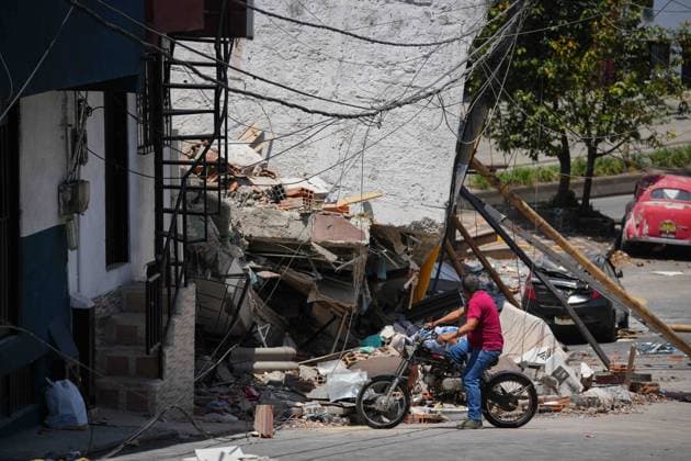 (260815) -- PEREIRA, Aug. 15, 2026 -- A man checks the damage of a building after an earthquake in Pereira, Colombia on Aug. 14, 2026. A 7.4-magnitude earthquake jolted western Colombia on Monday. (Photo by Xinhua) COLOMBIA-PEREIRA-EARTHQUAKE-AFTERMATH AndresxMoreno 