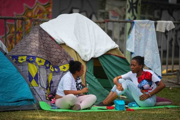 (260815) -- PEREIRA, Aug. 15, 2026 -- People talk at a temporary settlement at a park after an earthquake in Pereira, Colombia on Aug. 14, 2026. A 7.4-magnitude earthquake jolted western Colombia on Monday. (Photo by Xinhua) COLOMBIA-PEREIRA-EARTHQUAKE-AFTERMATH AndresxMoreno 