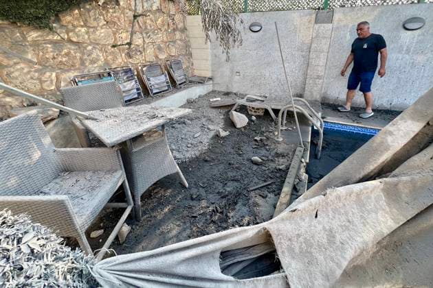 (260815) -- ANSAR, Aug. 15, 2026 -- A man inspects the damage after an Israeli airstrike on the outskirts of Ansar in the southern Nabatieh Governorate, Lebanon, Aug. 15, 2026. At least seven people were killed and three others injured early Saturday in an Israeli airstrike on a building on the outskirts of Ansar in the southern Nabatieh Governorate, Lebanon s National News Agency reported. (Photo by Xinhua) LEBANON-ANSAR-ISRAELI AIRSTRIKE-AFTERMATH AlixHashisho 