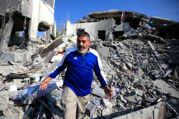 (260815) -- ANSAR, Aug. 15, 2026 -- A man inspects the damage after an Israeli airstrike on the outskirts of Ansar in the southern Nabatieh Governorate, Lebanon, Aug. 15, 2026. At least seven people were killed and three others injured early Saturday in an Israeli airstrike on a building on the outskirts of Ansar in the southern Nabatieh Governorate, Lebanon s National News Agency reported. (Photo by Xinhua) LEBANON-ANSAR-ISRAELI AIRSTRIKE-AFTERMATH AlixHashisho 