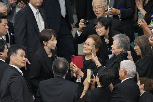 Japan s Prime Minister Sanae Takaichi speaks with bereaved families of the war dead after the memorial service for the war dead of World War II marking the 81st anniversary at Nippon Budokan in Tokyo, Japan on Saturday, August 15, 2026.  TKP2026081519 KEIZOxMORI