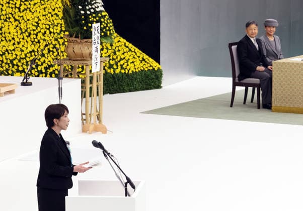 August 15, 2026, Tokyo, Japan - Japanese Prime Minister Sanae Takaichi (L) walks for a speech at the memorial service for the war dead at the Nippon Budokan hall in Tokyo on Saturday, August 15, 2026, while Emperor Naruhito (2nd R) and Empress Masako (R) look on. Japan marked the 81st anniversary of its surrender of World War II. (photo by Yoshio Tsunoda AFLO)  aflo_341018774