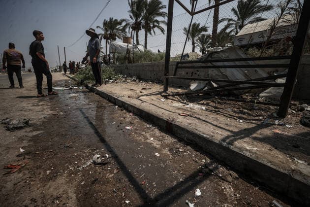 Israel launches airstrike on Gaza despite ceasefire DEIR AL-BALAH, GAZA, PALESTINE - AUGUST 15: Palestinians inspect the area following an Israeli drone strike on a motorcycle along Salah al-Din Street in Deir al-Balah in the central Gaza, Palestine, on August 15, 2026. Ali Jadallah Anadolu Deyr Balah Palestinian Territory, Occupied. Editorial use only. Please get in touch for any other usage.  Copyright: x2026xAnadoluxAlixJadallahx