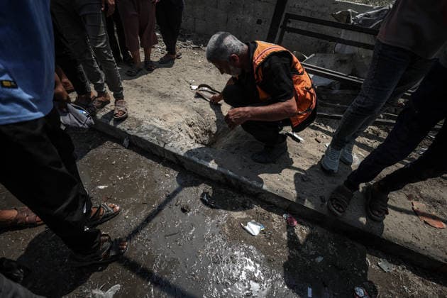 Israel launches airstrike on Gaza despite ceasefire DEIR AL-BALAH, GAZA, PALESTINE - AUGUST 15: Palestinians inspect the area following an Israeli drone strike on a motorcycle along Salah al-Din Street in Deir al-Balah in the central Gaza, Palestine, on August 15, 2026. Ali Jadallah Anadolu Deyr Balah Palestinian Territory, Occupied. Editorial use only. Please get in touch for any other usage.  Copyright: x2026xAnadoluxAlixJadallahx