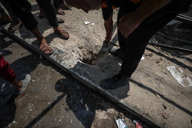 Israel launches airstrike on Gaza despite ceasefire DEIR AL-BALAH, GAZA, PALESTINE - AUGUST 15: Palestinians inspect the area following an Israeli drone strike on a motorcycle along Salah al-Din Street in Deir al-Balah in the central Gaza, Palestine, on August 15, 2026. Ali Jadallah Anadolu Deyr Balah Palestinian Territory, Occupied. Editorial use only. Please get in touch for any other usage.  Copyright: x2026xAnadoluxAlixJadallahx