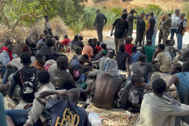 People intercepted by Moroccan security forces during an attempt by dozens of sub-Saharan migrants—who had gathered on the outskirts of the border town of Castillejos, Morocco—to cross into the Spanish city of Ceuta, 15 August 2026. Moroccan security sources told that the incident took place in a mountainous area on the outskirts of Castillejos, southwest of Ceuta. Morocco stop attempt by hundreds of sub-Saharan migrants to reach Ceuta !ACHTUNG: NUR REDAKTIONELLE NUTZUNG!  Copyright: xMohamedxSialix GRAF389 20260815-55021151037_1