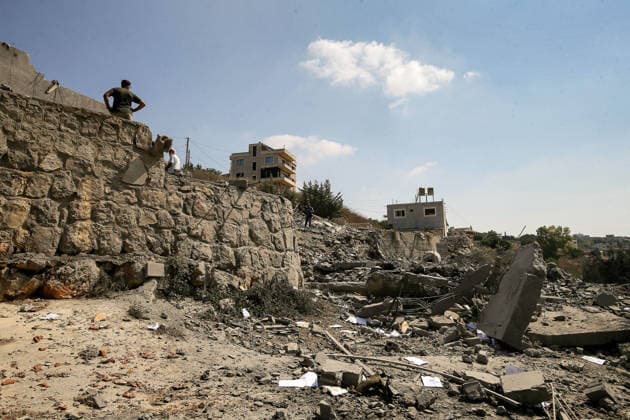 August 15, 2026, Ansar, Ansar, Lebanon: People inspect destruction caused by an Israeli air strike in the southern Lebanese village of Ansar. Seven people were killed and three other wounded in the attack, one of the deadliest attacks since a precarious truce between Israel and pro-Iranian Hezbollah went into effect on June 20. Ansar Lebanon  - ZUMAn313 20260815_zip_n313_007 Copyright: xMarwanxNaamanix