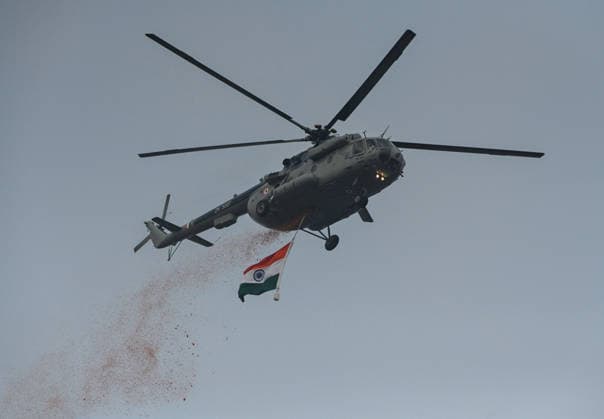 NEW DELHI, INDIA - AUGUST 15: An IAF Mi-17 helicopter showers flower petal during the 80th Independence Day celebrations at Red Fort on August 15, 2026 in New Delhi, India. For the first time, the national song, Vande Mataram , was rendered during the celebrations at the Red Fort. The National Anthem rendition was synchronised with the 21-gun salute by the gunners of the 1721 Field Battery (Ceremonial), utilising the indigenous 105mm Light Field Guns. PM Modi announced a nationwide initiative to provide free online coaching for competitive exams during his Independence Day address on August 15, 2026. The scheme aims to leverage India s digital infrastructure and top educators to ease the heavy financial burden private coaching hubs place o