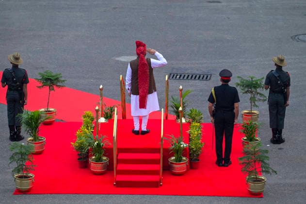 NEW DELHI, INDIA - AUGUST 15: Prime Minister Narendra Modi inspects a Guard of Honour on 80th Independence Day at the Red Fort on August 15, 2026 in New Delhi, India. For the first time, the national song, Vande Mataram , was rendered during the celebrations at the Red Fort. The National Anthem rendition was synchronised with the 21-gun salute by the gunners of the 1721 Field Battery (Ceremonial), utilising the indigenous 105mm Light Field Guns. PM Modi announced a nationwide initiative to provide free online coaching for competitive exams during his Independence Day address on August 15, 2026. The scheme aims to leverage India s digital infrastructure and top educators to ease the heavy financial burden private coaching hubs place on poor