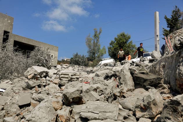 August 15, 2026, Ansar, Ansar, Lebanon: People inspect destruction caused by an Israeli air strike in the southern Lebanese village of Ansar. Seven people were killed and three other wounded in the attack, one of the deadliest attacks since a precarious truce between Israel and pro-Iranian Hezbollah went into effect on June 20. Ansar Lebanon - ZUMAn313 20260815_zip_n313_006 Copyright: xMarwanxNaamanix