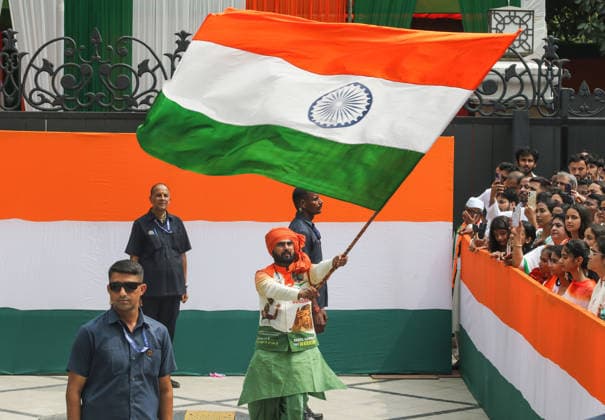 80th Independence Day celebrations at Indira Bhawan New Delhi, Aug 15 (ANI): An artist holds giant Tiranga flag during the 80th Independence Day celebrations at Indira Bhawan, in New Delhi on Saturday. New Delhi Delhi India Copyright: xANIx ANI_20260815381