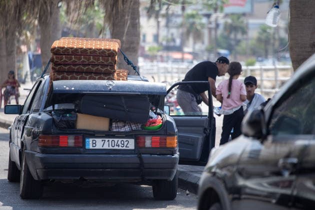 Lebanese families flee north as Israeli strikes persist despite ceasefire SIDON, LEBANON - AUGUST 15: Traffic backs up along roads in Sidon, southern Lebanon, on August 15, 2026, as families flee their homes in vehicles following continued Israeli military strikes despite a ceasefire agreement. Displaced residents packed personal belongings into cars and trucks, creating major gridlock through the port city as they sought safety in regions further north. Mohammad Abushama Anadolu Sidon Lebanon. Editorial use only. Please get in touch for any other usage.  Copyright: x2026xAnadoluxMohammadxAbushamax