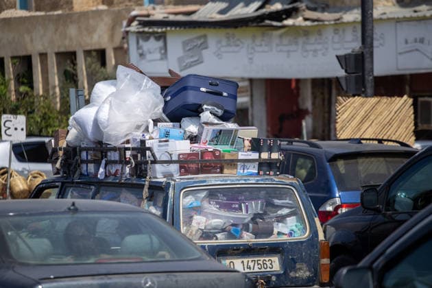 Lebanese families flee north as Israeli strikes persist despite ceasefire SIDON, LEBANON - AUGUST 15: Traffic backs up along roads in Sidon, southern Lebanon, on August 15, 2026, as families flee their homes in vehicles following continued Israeli military strikes despite a ceasefire agreement. Displaced residents packed personal belongings into cars and trucks, creating major gridlock through the port city as they sought safety in regions further north. Mohammad Abushama Anadolu Sidon Lebanon. Editorial use only. Please get in touch for any other usage.  Copyright: x2026xAnadoluxMohammadxAbushamax