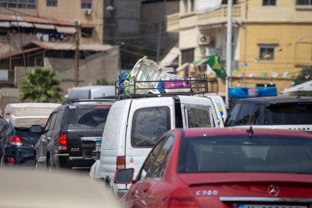 Lebanese families flee north as Israeli strikes persist despite ceasefire SIDON, LEBANON - AUGUST 15: Traffic backs up along roads in Sidon, southern Lebanon, on August 15, 2026, as families flee their homes in vehicles following continued Israeli military strikes despite a ceasefire agreement. Displaced residents packed personal belongings into cars and trucks, creating major gridlock through the port city as they sought safety in regions further north. Mohammad Abushama Anadolu Sidon Lebanon. Editorial use only. Please get in touch for any other usage.  Copyright: x2026xAnadoluxMohammadxAbushamax