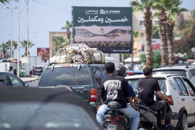 Lebanese families flee north as Israeli strikes persist despite ceasefire SIDON, LEBANON - AUGUST 15: Traffic backs up along roads in Sidon, southern Lebanon, on August 15, 2026, as families flee their homes in vehicles following continued Israeli military strikes despite a ceasefire agreement. Displaced residents packed personal belongings into cars and trucks, creating major gridlock through the port city as they sought safety in regions further north. Mohammad Abushama Anadolu Sidon Lebanon. Editorial use only. Please get in touch for any other usage.  Copyright: x2026xAnadoluxMohammadxAbushamax