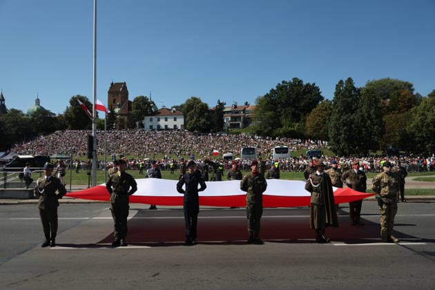 Polish Armed Forces Day Celebrated in Warsaw WARSAW, POLAND - AUGUST 15: Soldiers hold a Polish flag during a military parade on Polish Armed Forces Day in Warsaw, Poland on 15th August, 2026. Every year on 15 August Poland commemorates the Battle of Warsaw, also known as the Miracle on the Vistula. In 1920, the Polish army stopped Soviet troops, preventing their aggression against Europe. Beata Zawrzel Anadolu Warsaw Poland. Editorial use only. Please get in touch for any other usage.  Copyright: x2026xAnadoluxBeataxZawrzelx