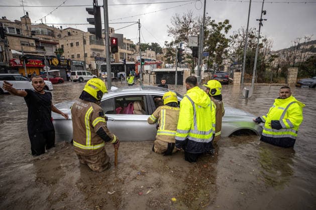 Flash floods submerge vehicles in East Jerusalem neighborhood following heavy rainfall EAST JERUSALEM - AUGUST 15: People wade through flooded roads and submerged vehicles are seen in the Wadi al-Joz neighborhood of East Jerusalem on August 15, 2026, after unseasonal heavy rainfall triggered localized flash flooding across the area. Search and rescue teams were dispatched to the district as rising waters trapped cars, disrupted traffic flow, and damaged infrastructure across low-lying urban streets. Mostafa Alkharouf Anadolu Jerusalem Israel. Editorial use only. Please get in touch for any other usage.  Copyright: x2026xAnadoluxMostafaxAlkharoufx