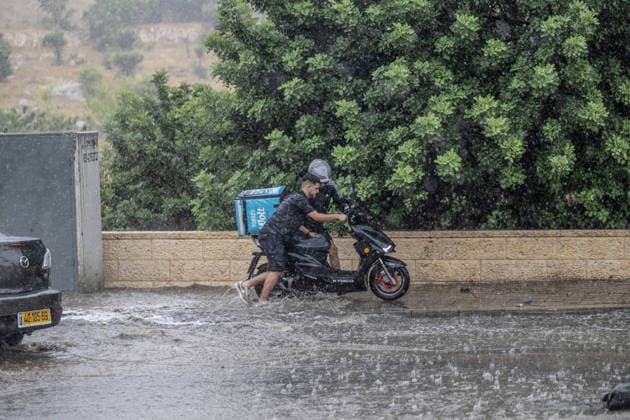Flash floods submerge vehicles in East Jerusalem neighborhood following heavy rainfall EAST JERUSALEM - AUGUST 15: People wade through flooded roads and submerged vehicles are seen in the Wadi al-Joz neighborhood of East Jerusalem on August 15, 2026, after unseasonal heavy rainfall triggered localized flash flooding across the area. Search and rescue teams were dispatched to the district as rising waters trapped cars, disrupted traffic flow, and damaged infrastructure across low-lying urban streets. Mostafa Alkharouf Anadolu Jerusalem Israel. Editorial use only. Please get in touch for any other usage.  Copyright: x2026xAnadoluxMostafaxAlkharoufx