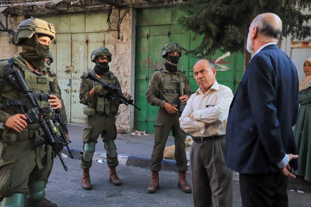 Israeli settlers raid historic Old City of Hebron in West Bank under military escort HEBRON, WEST BANK, PALESTINE - AUGUST 15: Israeli military personnel restrict the movement of local Palestinians during a raid by Israeli settlers in the Old City of Hebron, located in the southern West Bank, Palestine on August 15, 2026. Escorted by armed Israeli forces, the settlers entered the historic district while soldiers blocked key entry and exit points, severely limiting the daily mobility and access of Palestinian residents living in the area. Amer Shallodi Anadolu Hebron West Bank. Editorial use only. Please get in touch for any other usage.  Copyright: x2026xAnadoluxAmerxShallodix