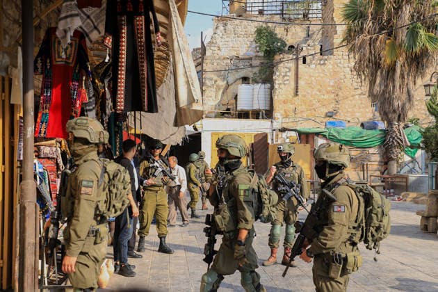 Israeli settlers raid historic Old City of Hebron in West Bank under military escort HEBRON, WEST BANK, PALESTINE - AUGUST 15: Israeli military personnel restrict the movement of local Palestinians during a raid by Israeli settlers in the Old City of Hebron, located in the southern West Bank, Palestine on August 15, 2026. Escorted by armed Israeli forces, the settlers entered the historic district while soldiers blocked key entry and exit points, severely limiting the daily mobility and access of Palestinian residents living in the area. Amer Shallodi Anadolu Hebron West Bank. Editorial use only. Please get in touch for any other usage.  Copyright: x2026xAnadoluxAmerxShallodix