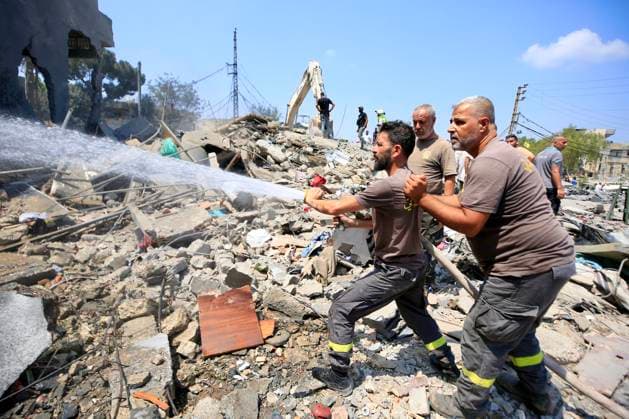 (260815) -- DEIR AL ZAHRANI, Aug. 15, 2026 -- Firefighters put out a fire following Israeli airstrikes in Deir Al Zahrani, southern Lebanon, Aug. 15, 2026. Lebanese broadcaster Al-Jadeed TV reported that four people were killed and nine others wounded after an Israeli airstrike hit a two-story building in the town of Deir Al Zahrani in the Nabatieh District. (Photo by Xinhua) LEBANON-DEIR AL ZAHRANI-ISRAELI AIRSTRIKE AlixHashisho 