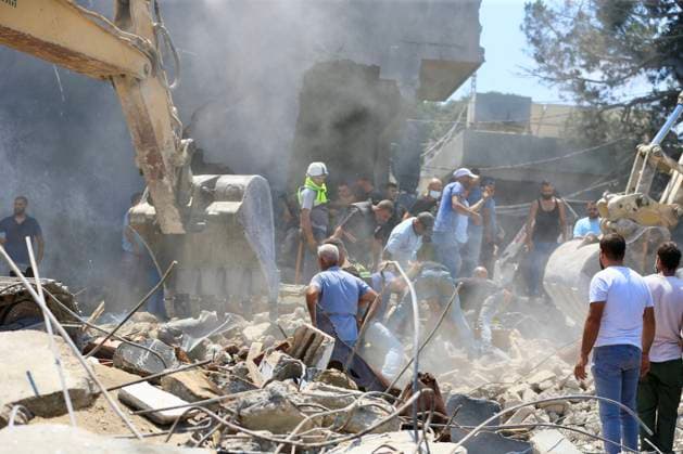 (260815) -- DEIR AL ZAHRANI, Aug. 15, 2026 -- Rescuers search through the rubble of buildings hit by Israeli airstrikes in Deir Al Zahrani, southern Lebanon, Aug. 15, 2026. Lebanese broadcaster Al-Jadeed TV reported that four people were killed and nine others wounded after an Israeli airstrike hit a two-story building in the town of Deir Al Zahrani in the Nabatieh District. (Photo by Xinhua) LEBANON-DEIR AL ZAHRANI-ISRAELI AIRSTRIKE AlixHashisho 