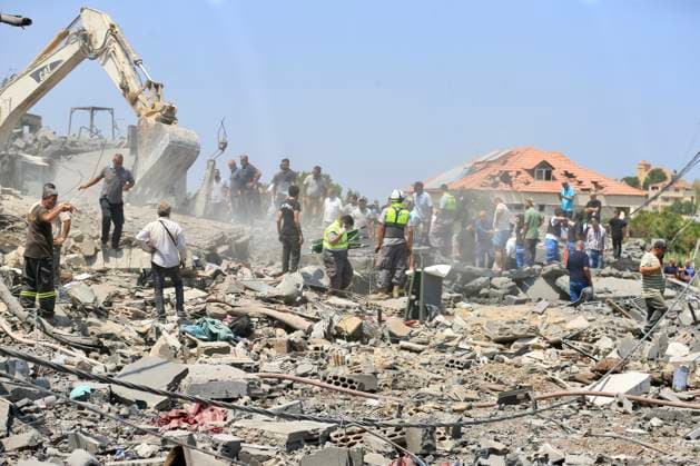 (260815) -- DEIR AL ZAHRANI, Aug. 15, 2026 -- Rescuers search through the rubble of buildings hit by Israeli airstrikes in Deir Al Zahrani, southern Lebanon, Aug. 15, 2026. Lebanese broadcaster Al-Jadeed TV reported that four people were killed and nine others wounded after an Israeli airstrike hit a two-story building in the town of Deir Al Zahrani in the Nabatieh District. (Photo by Xinhua) LEBANON-DEIR AL ZAHRANI-ISRAELI AIRSTRIKE AlixHashisho 