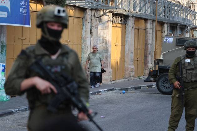 Israeli settlers enter Hebron™s Old City under army protection HEBRON, WEST BANK, PALESTINE, AUGUST 15, 2026: Israeli settlers enter the Old City of Hebron under the protection of Israeli soldiers, while Palestinians, including women and children, are prevented from reaching their homes. The incident took place amid heightened tensions in the occupied West Bank. HEBRON Palestine, State of Copyright: x xMosabxshawerx xJNAxPressx